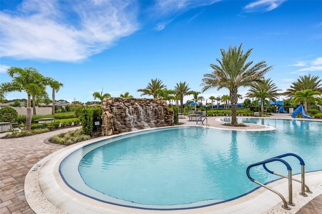 view of swimming pool with a patio