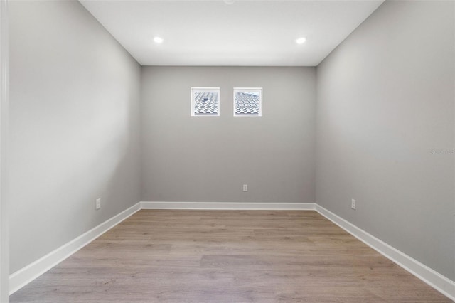 unfurnished room with light hardwood / wood-style flooring