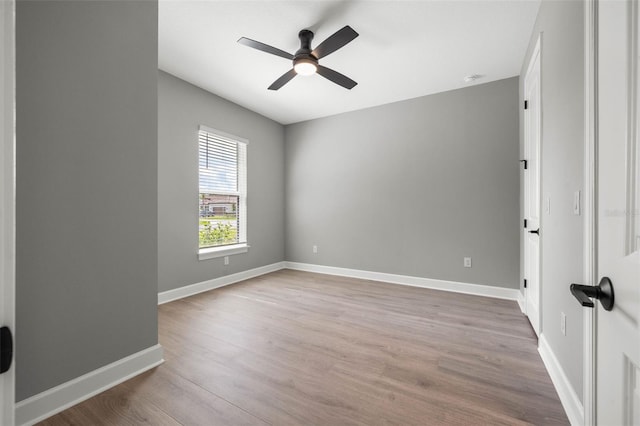 empty room with wood-type flooring and ceiling fan