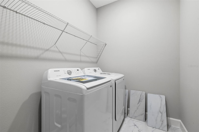 laundry area with independent washer and dryer