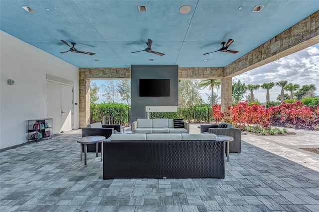 view of patio / terrace with ceiling fan and outdoor lounge area