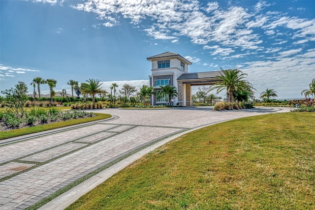 view of property's community with a lawn