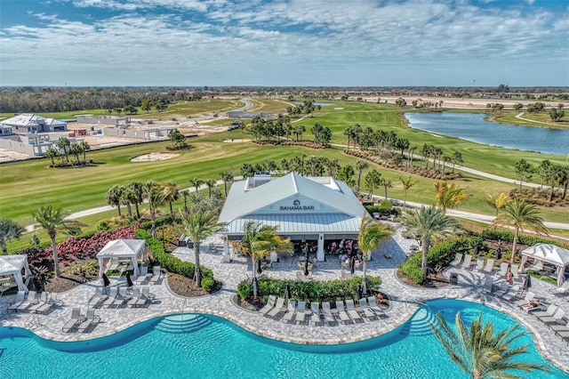 view of swimming pool featuring a gazebo and a water view