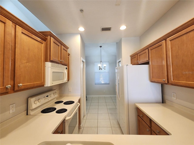 kitchen featuring hanging light fixtures, white appliances, light tile patterned flooring, and a notable chandelier