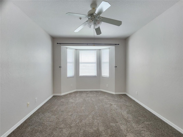 unfurnished room featuring carpet and ceiling fan