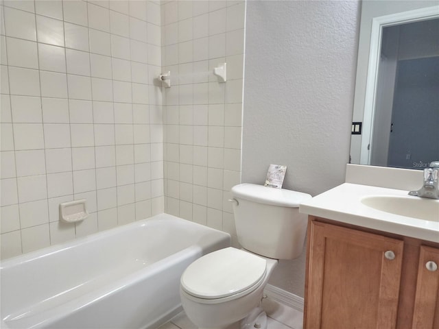 full bathroom featuring tiled shower / bath, vanity, and toilet