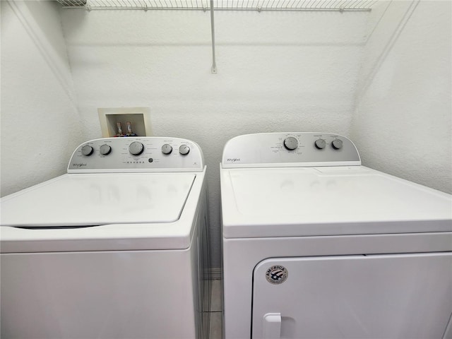 washroom with separate washer and dryer