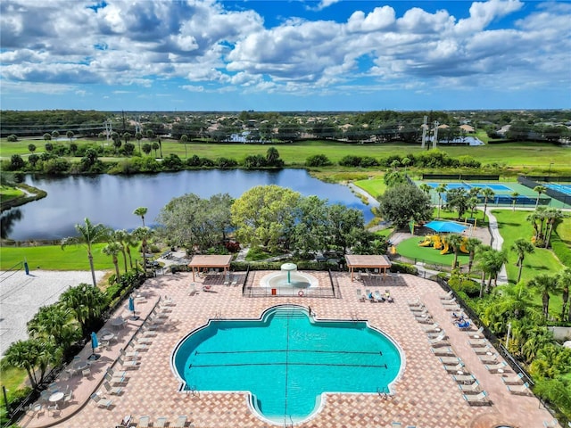 view of swimming pool featuring a water view and a patio area