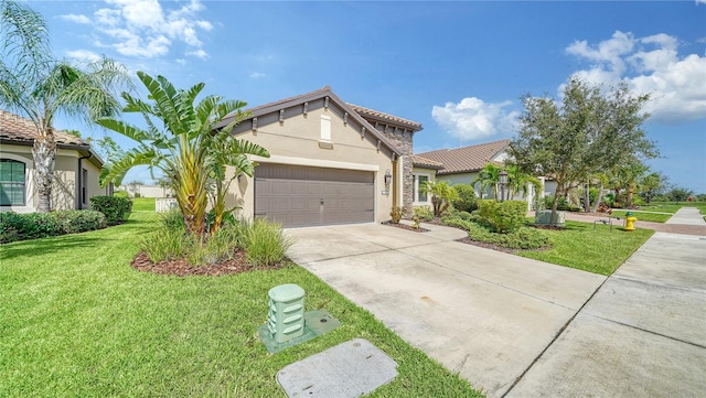 mediterranean / spanish-style home featuring a front yard and a garage