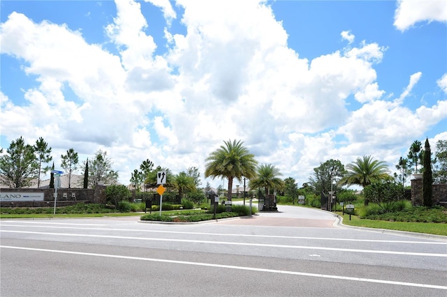 view of street with curbs and traffic signs