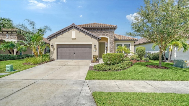 mediterranean / spanish-style home featuring a garage, stucco siding, a tile roof, and a front yard