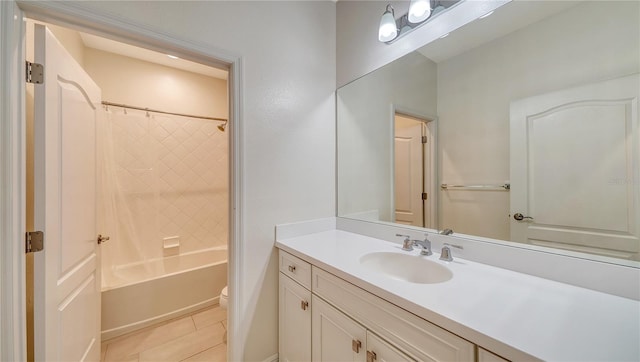 full bath featuring baseboards, toilet, shower / bath combination, vanity, and tile patterned flooring