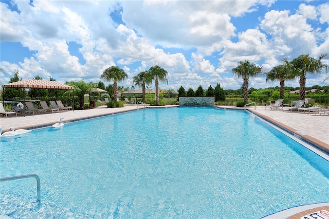 view of swimming pool with a patio