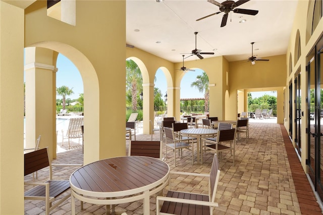 view of patio / terrace featuring outdoor dining space and a ceiling fan
