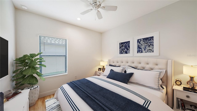 bedroom with recessed lighting, ceiling fan, wood finished floors, and baseboards
