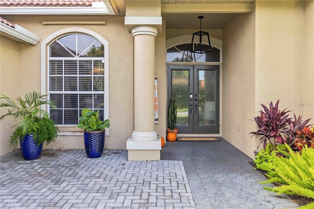 entrance to property featuring french doors