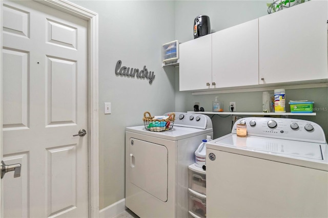 washroom with cabinets and separate washer and dryer