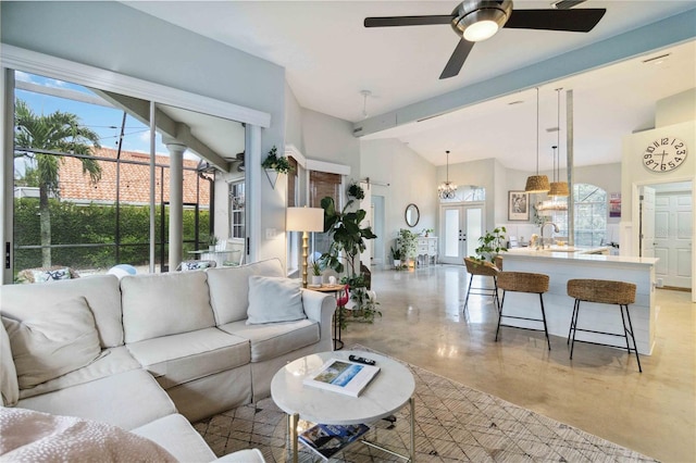 living room with ceiling fan, lofted ceiling with beams, and sink