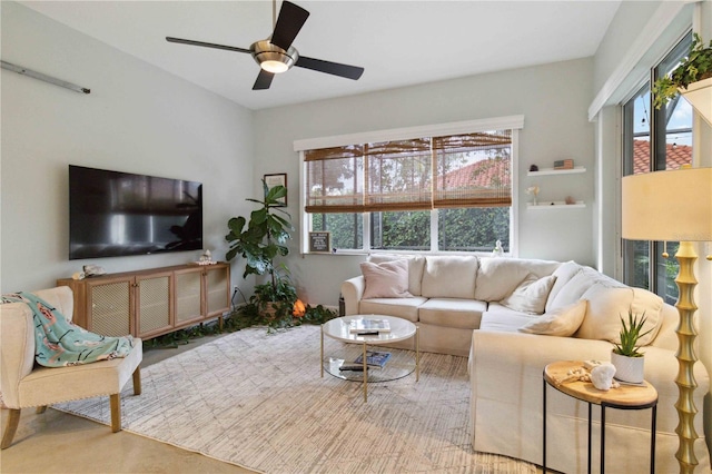 living room with ceiling fan and a healthy amount of sunlight