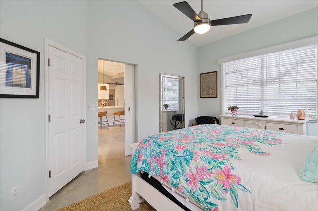 bedroom featuring vaulted ceiling, multiple windows, and ceiling fan