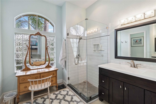 bathroom with vanity and an enclosed shower