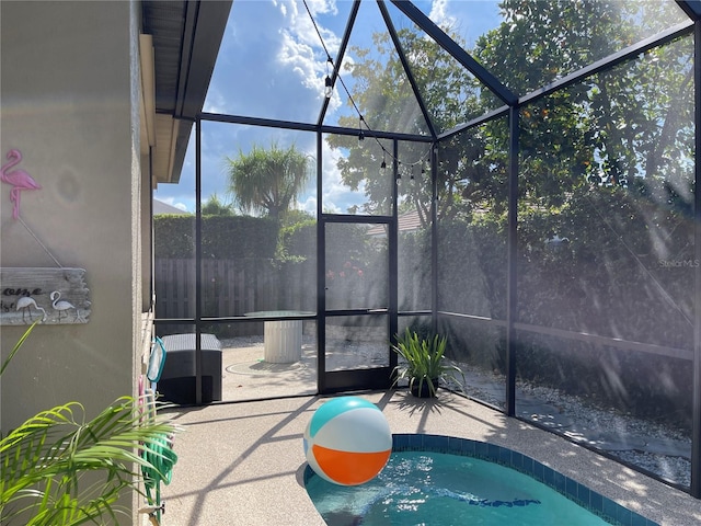 view of pool featuring a lanai and a patio area