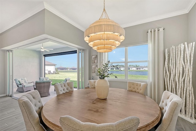 dining area with ceiling fan with notable chandelier, light hardwood / wood-style floors, and ornamental molding