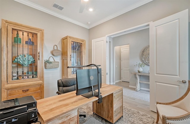 office featuring light wood-type flooring, ornamental molding, and ceiling fan