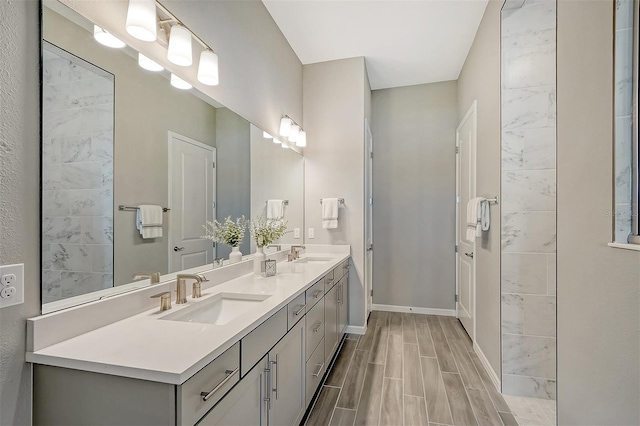 bathroom with vanity and hardwood / wood-style flooring