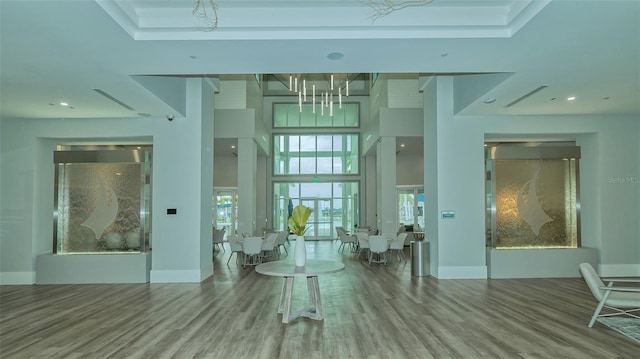 interior space featuring a healthy amount of sunlight and hardwood / wood-style floors