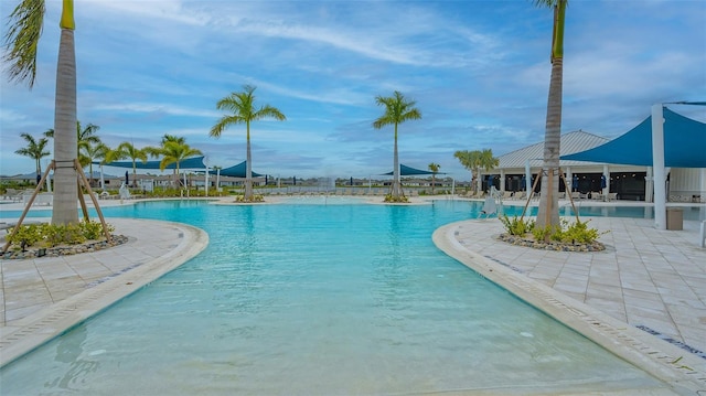 view of swimming pool featuring a patio