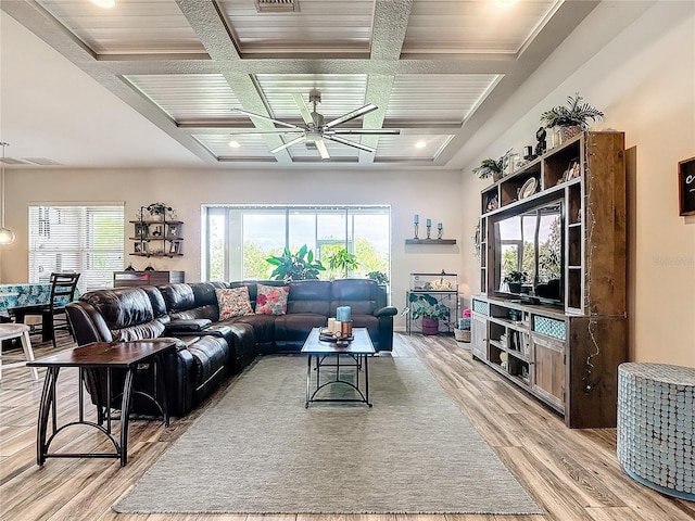 living room with beamed ceiling, ceiling fan, light hardwood / wood-style flooring, and coffered ceiling