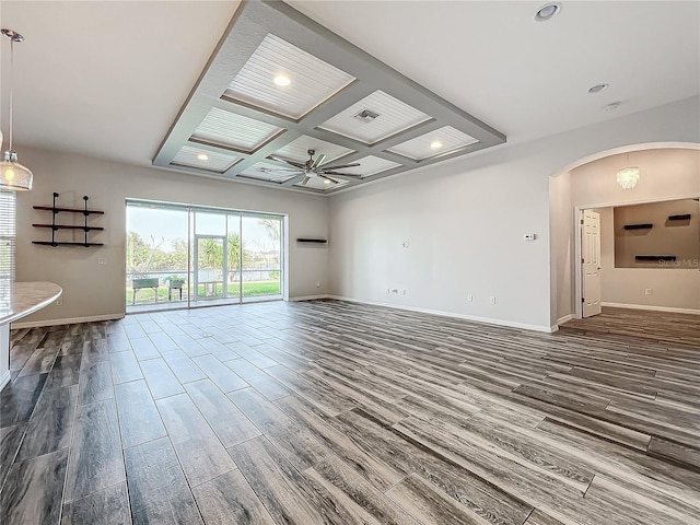 empty room featuring beam ceiling, ceiling fan, and coffered ceiling