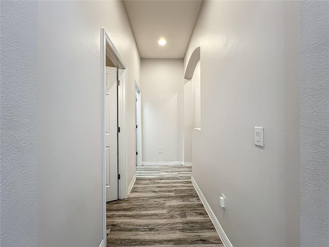 hallway featuring dark hardwood / wood-style floors