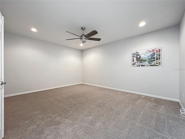 empty room featuring ceiling fan and carpet floors