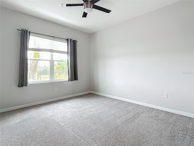 spare room featuring carpet flooring and ceiling fan