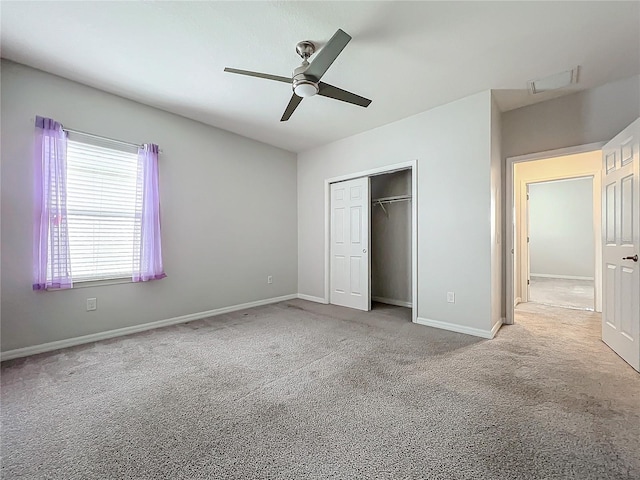 unfurnished bedroom with light carpet, a closet, and ceiling fan