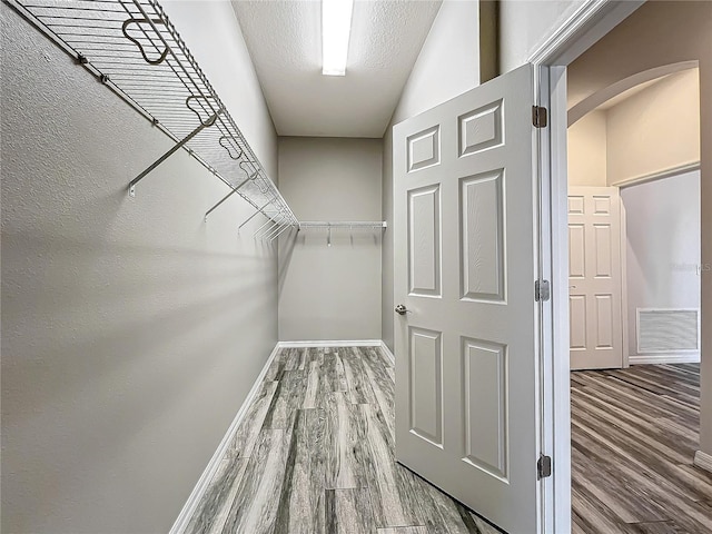 walk in closet featuring wood-type flooring