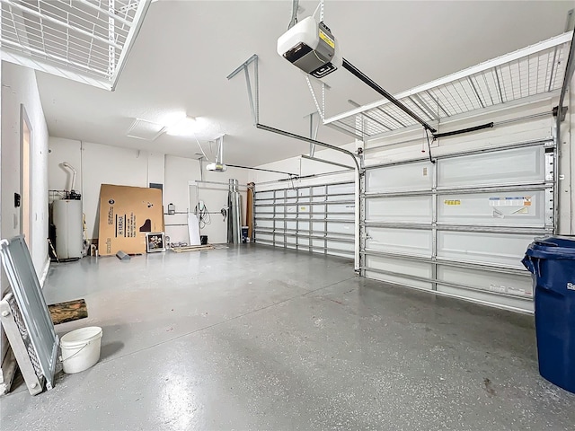 garage featuring water heater and a garage door opener