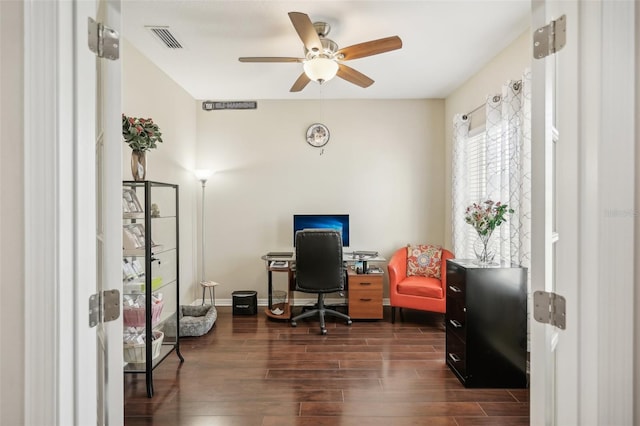 office with ceiling fan and dark wood-type flooring