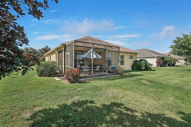 back of property featuring a yard and a lanai