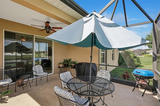 sunroom featuring ceiling fan