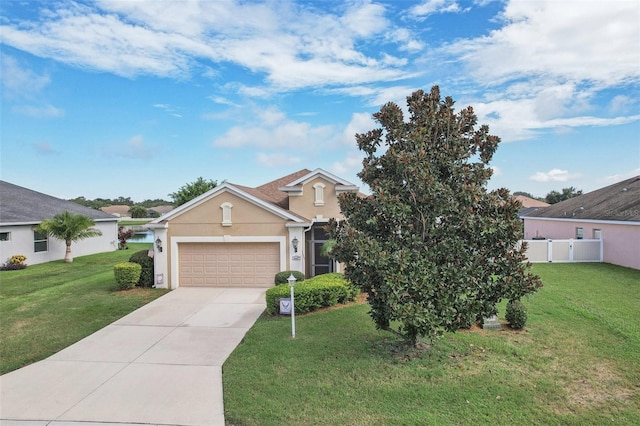 view of front of home featuring a garage and a front lawn