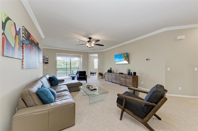 living room featuring ceiling fan, ornamental molding, and carpet