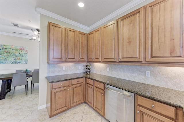 kitchen featuring stainless steel dishwasher, ornamental molding, dark stone countertops, and ceiling fan