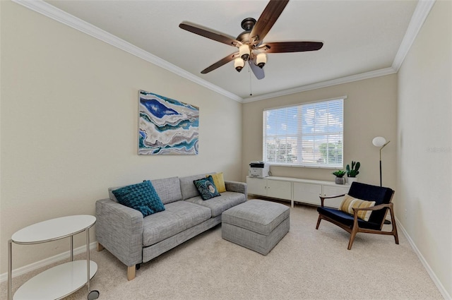 carpeted living room with ornamental molding and ceiling fan