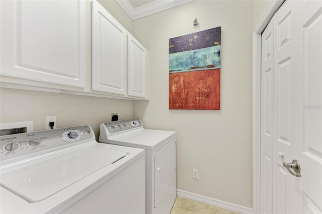 washroom featuring washing machine and dryer, ornamental molding, light tile patterned floors, and cabinets