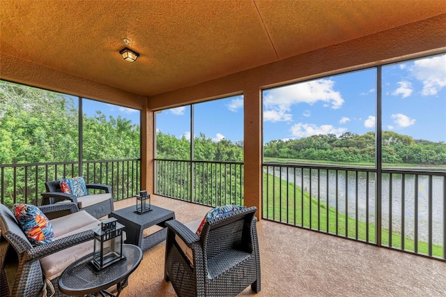 sunroom with a water view