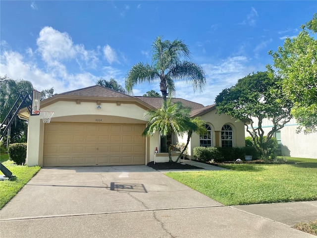 view of front of house featuring a front yard and a garage