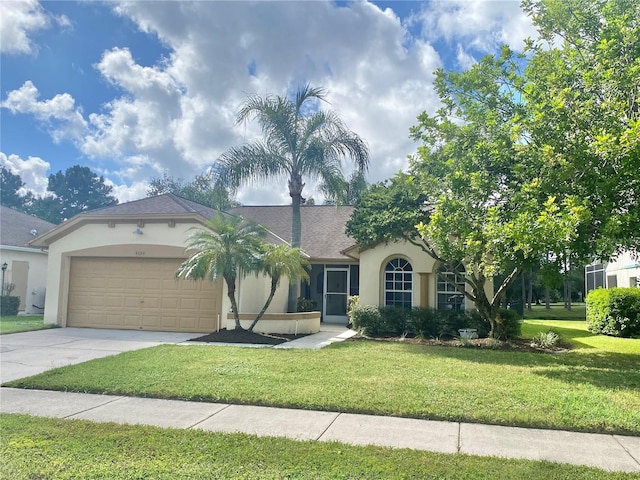 view of front facade with a front yard and a garage